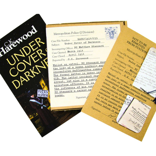 Book titled 'Under Cover in Darkness' by C.K. Harewood with Audio CD Boxset and Bookmark