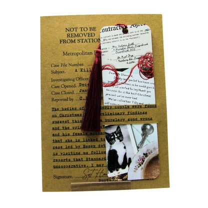 Decorative bookmark with tassel on a textured card with text and images.