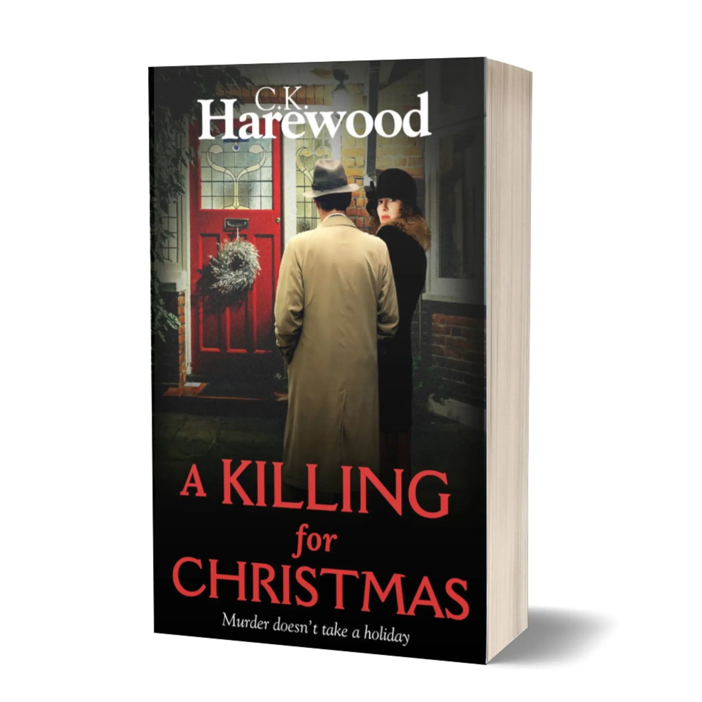 Man and woman in period dress standing outside a red front door.