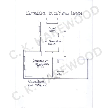 Floor plan of a police station in London with labeled rooms.
