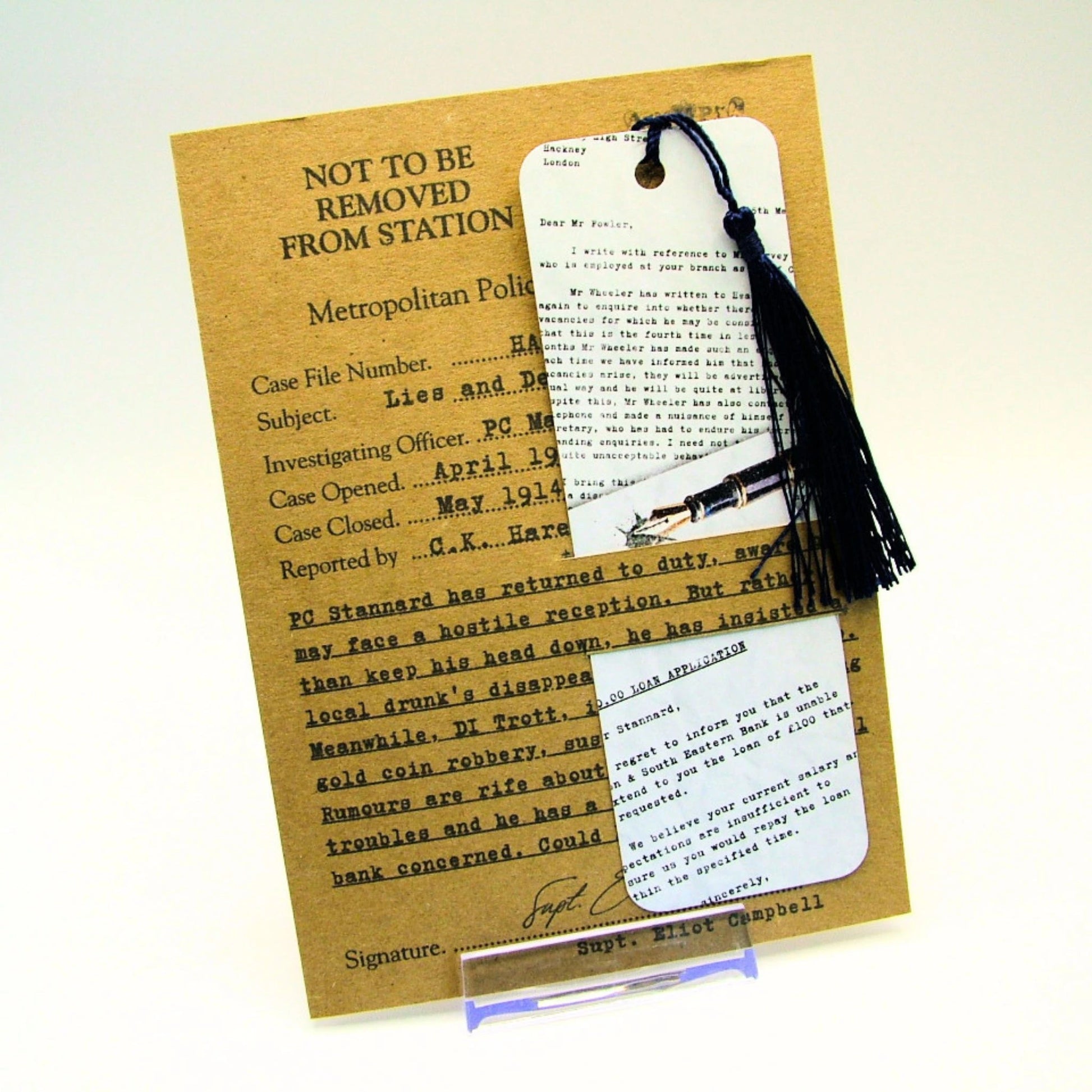 Vintage-style document with a tassel bookmark on a white background