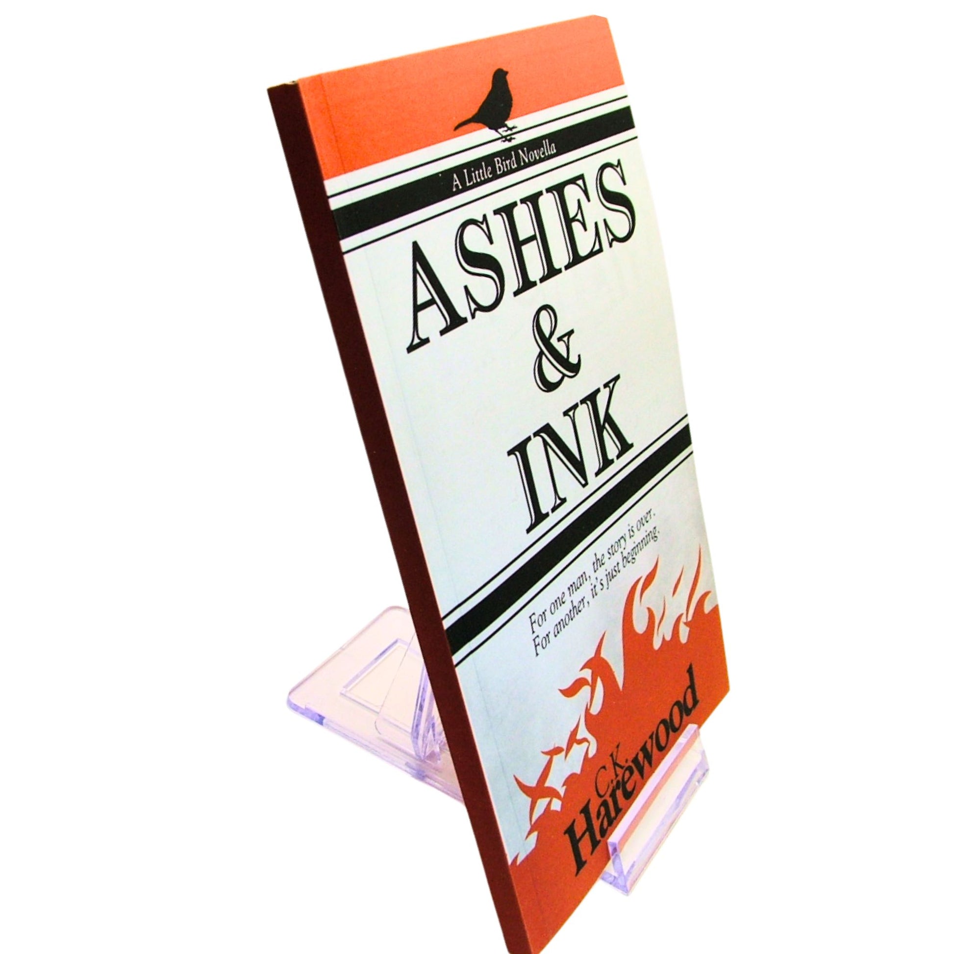 Book titled 'Ashes & Ink' by C.J. Harewood on a white background