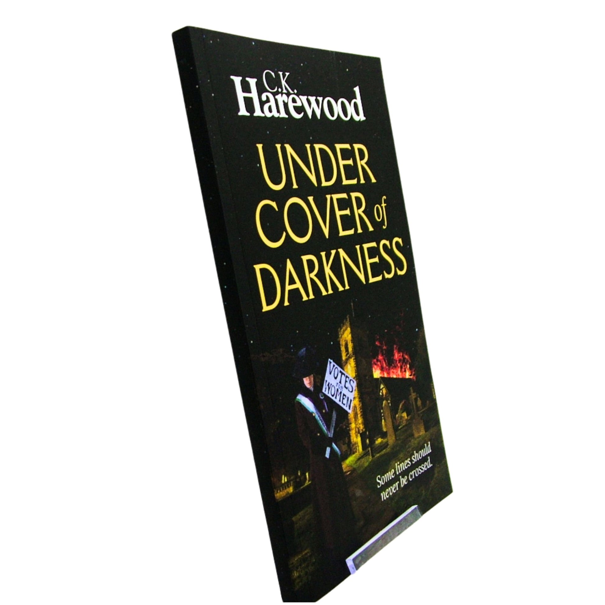 Book titled 'Under Cover of Darkness' by C.K. Harewood on a white background