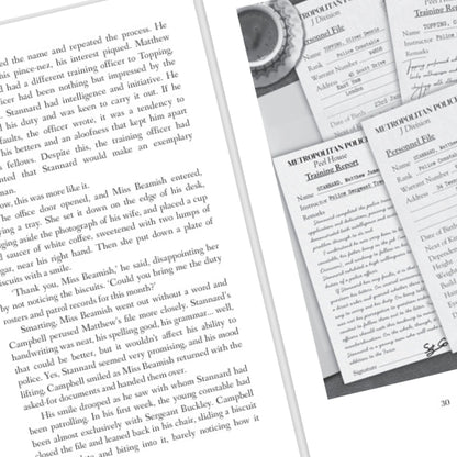 Close-up of a book page with text and a coffee cup in the corner.