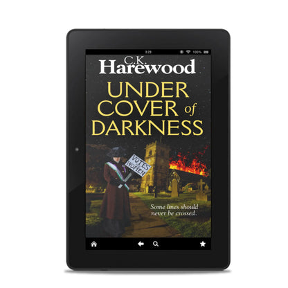 E-reader displaying the book 'Under Cover of Darkness' by C.K. Harewood on a white background